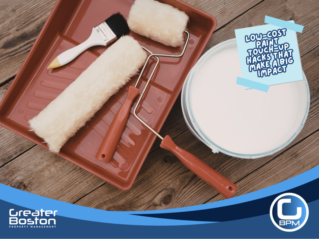 Paint touch-up tools including roller tray, paint cans, and brushes on craft paper