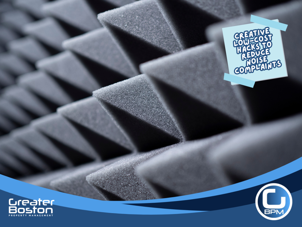 Close-up view of black acoustic foam panels with pyramid texture used for soundproofing.