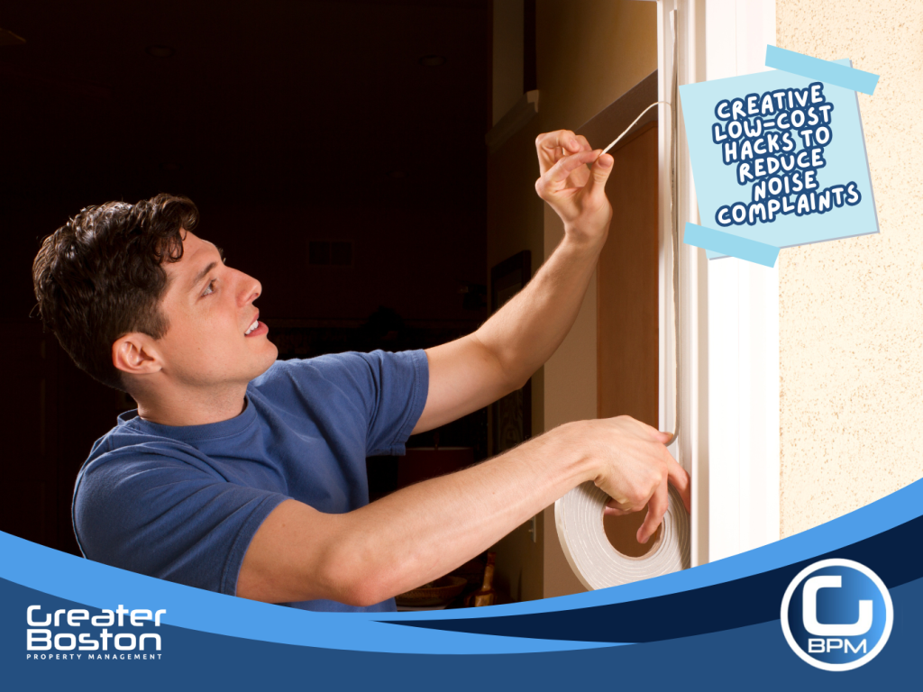Man applying weatherstripping to a door frame to reduce noise and improve insulation.