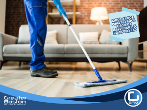 Professional cleaner mopping wooden floor in modern living room for landlord and homeowner maintenance