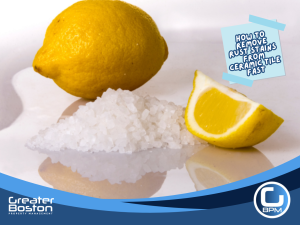 Fresh lemon and coarse salt used as a natural DIY solution to remove rust stains from ceramic tile