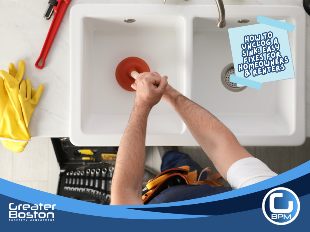 Person using a plunger to unclog a kitchen sink with tools and gloves nearby