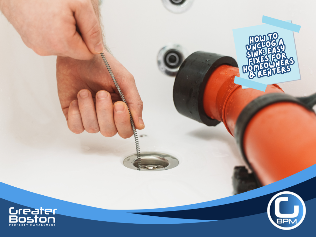 Using a drain snake tool to unclog a stubborn sink drain