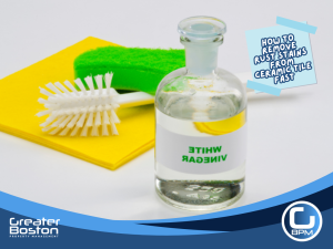 White vinegar with cleaning brush and sponge used as an eco-friendly solution to remove rust stains from ceramic tile