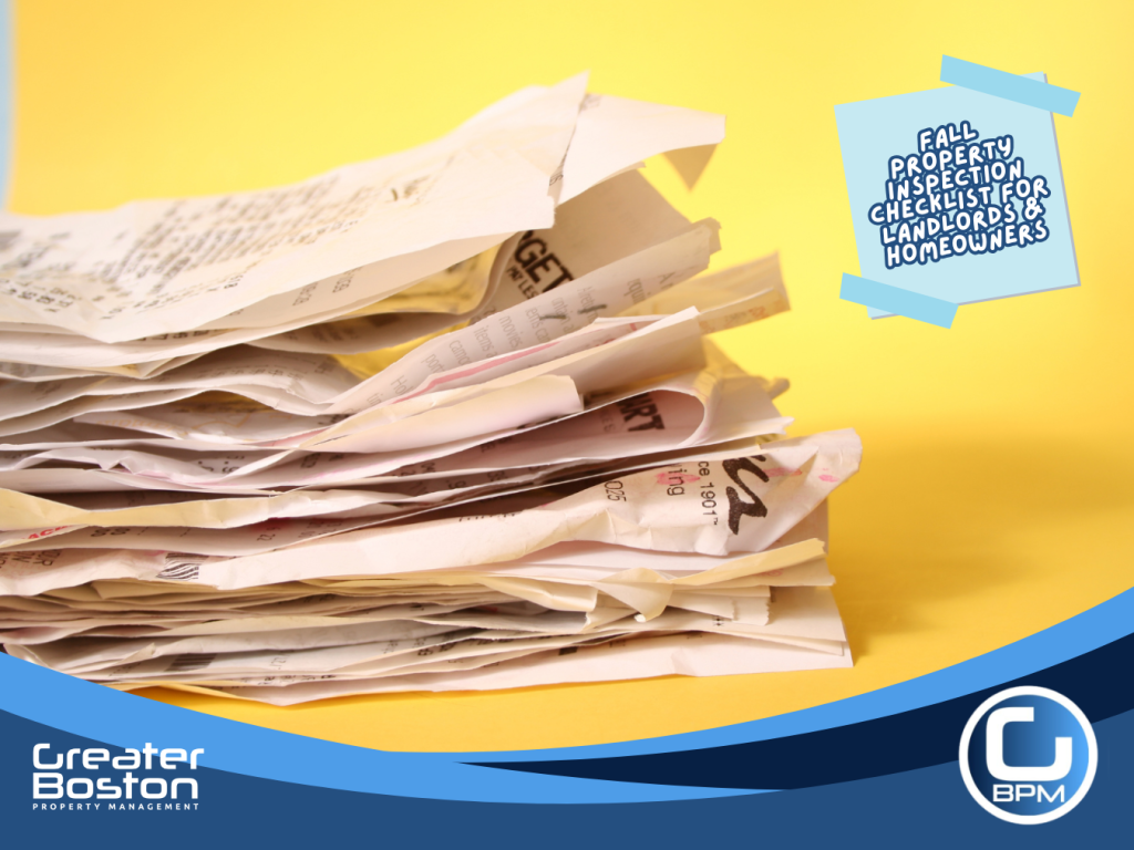 Stack of home maintenance receipts for landlord property inspection and tax documentation