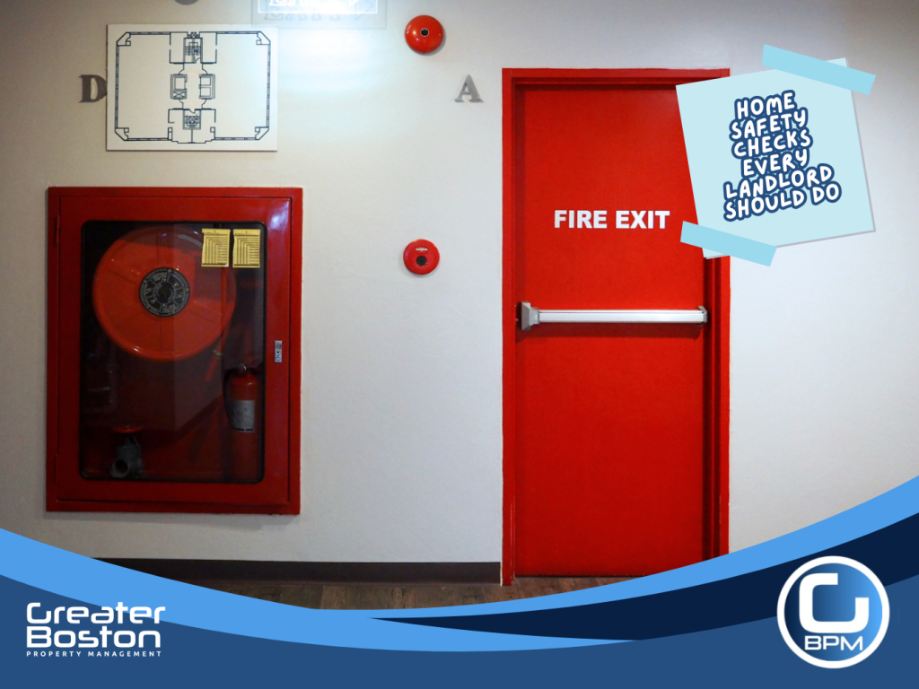 Fire exit door and extinguisher in apartment hallway during property safety inspection