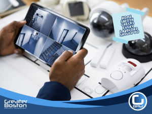 Landlord reviewing home security camera footage during property safety inspection