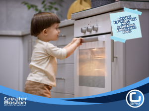Toddler reaching for a hot oven in a kitchen, demonstrating common home safety hazards and accident risks for landlords and homeowners.