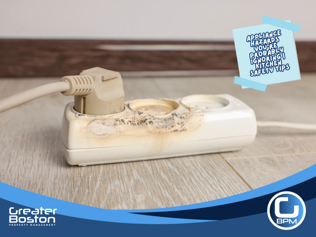 Burnt power strip showing fire damage from overloaded extension cord, demonstrating a major kitchen appliance safety hazard for landlords and homeowners.