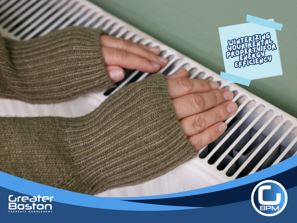 Hands warming over a home radiator showing efficient heating system maintenance during winter in a rental property.