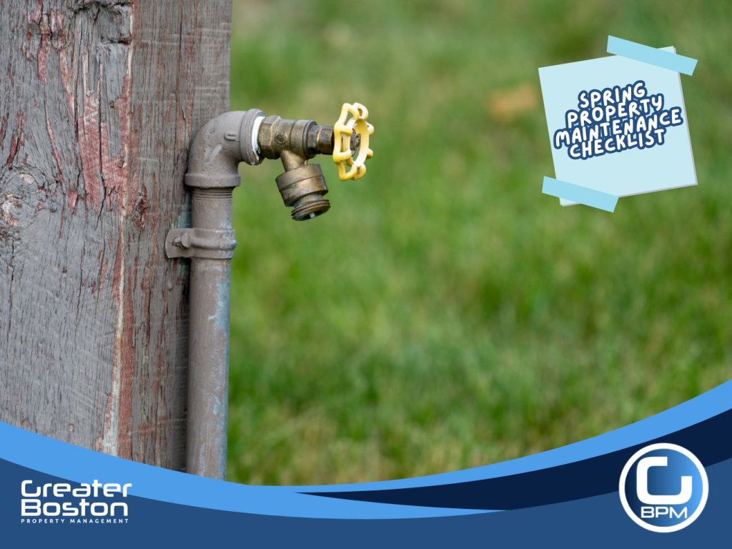 Outdoor water spigot connected to pipe being inspected for freeze damage during spring plumbing maintenance.