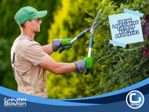 Landscaper trimming hedges to improve curb appeal as part of spring landscaping maintenance for rental properties.