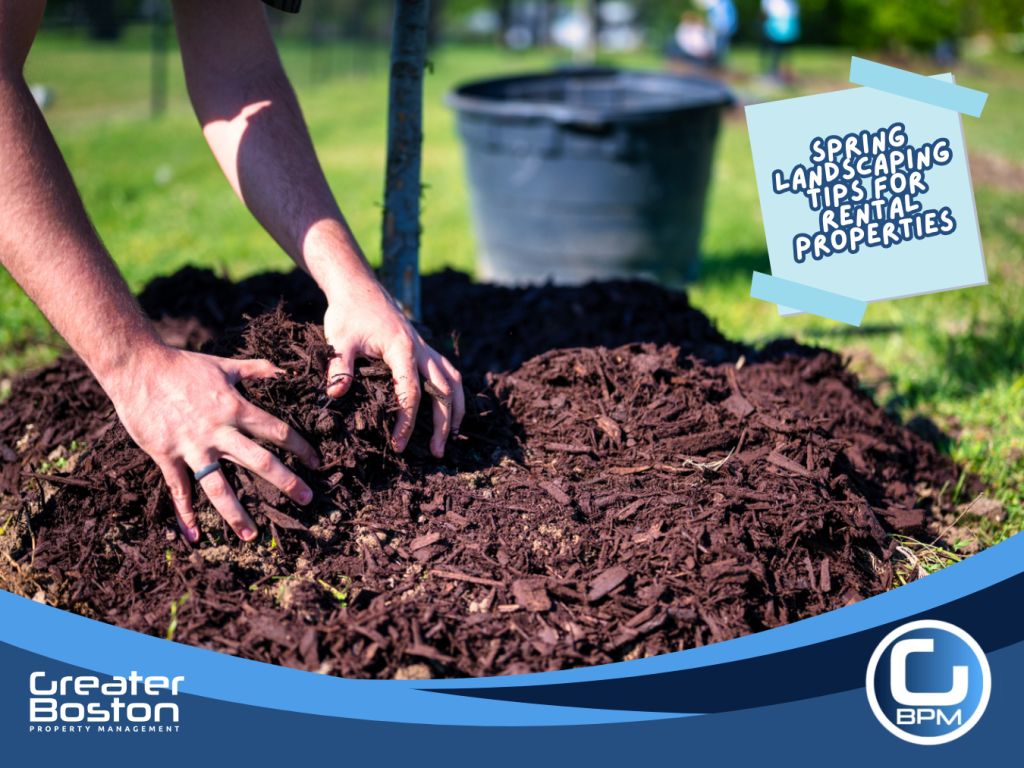 Applying fresh mulch around garden beds to improve curb appeal and soil health in rental property landscaping.