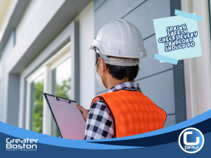 Property inspector with clipboard performing exterior safety inspection of rental property during spring maintenance.