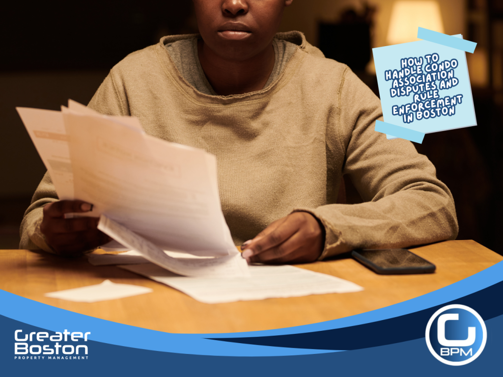 Boston condo unit owner reviewing a rule violation notice document at night representing the step-by-step enforcement process for condo association trustees in 2026