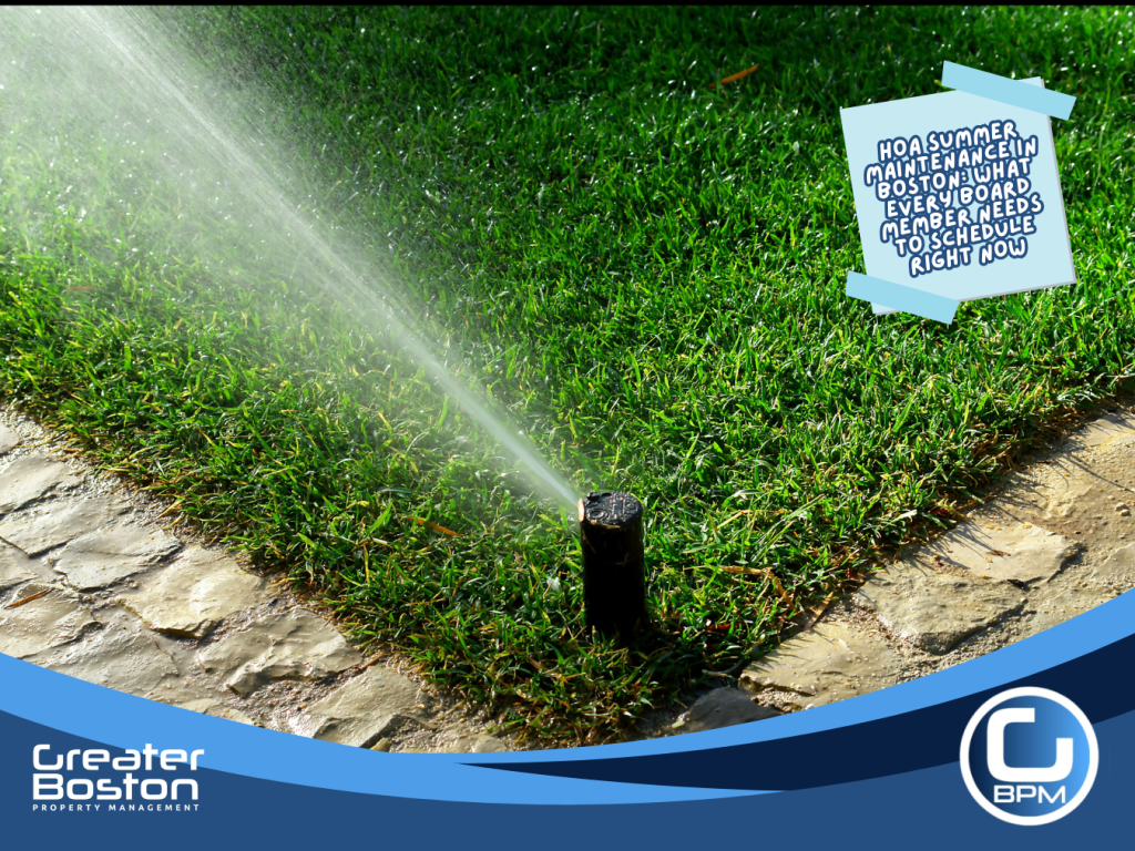 Boston HOA common area irrigation sprinkler head activating on green lawn representing summer irrigation system startup and landscaping grounds maintenance scheduled by board members in 2026