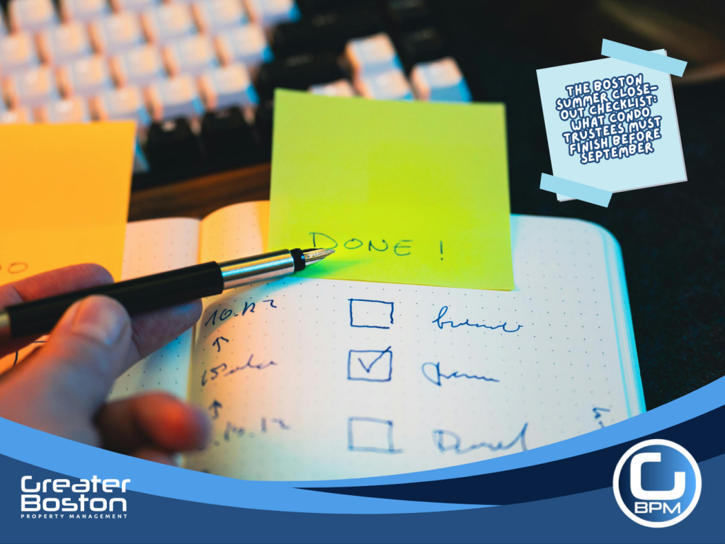 Boston condo trustee marking tasks done on summer close-out checklist notebook with pen and sticky note representing the six essential tasks condo trustees must complete and document before September 1 in 2026