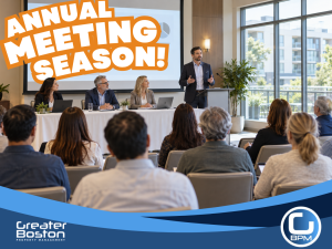 Boston condo association annual meeting with trustee board presenting to assembled unit owners at professional venue representing the September preparation guide for condo trustees before annual meeting season in 2026