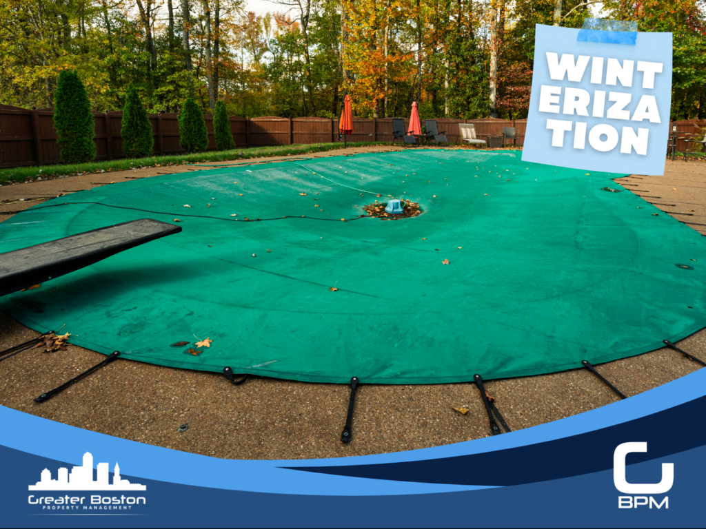 Boston condo association pool fully covered with secured green winter cover surrounded by fall foliage representing the complete pool winterization closing sequence including water chemistry equipment drainage line blow-out and Massachusetts Board of Health chemical storage compliance in 2026